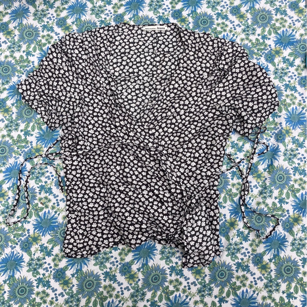 Reformation wrap top with ditsy daisy pattern